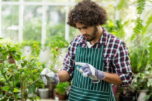 Gardeners tending to lush green lawns in Finsbury Park