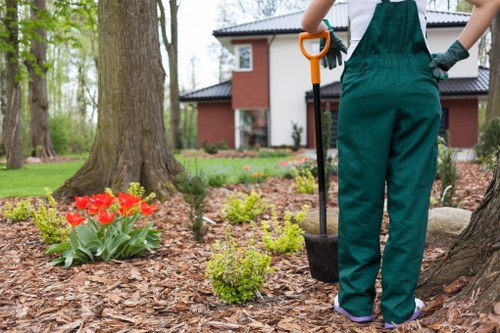 PPE lineup including boots, gloves and visors for garden crew